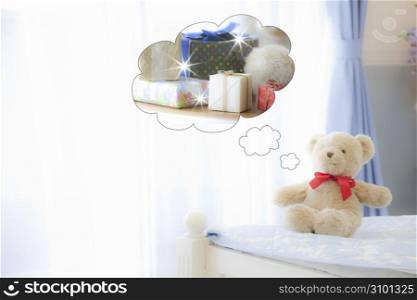 Teddy bear sat on the end of the bed thinking about presents