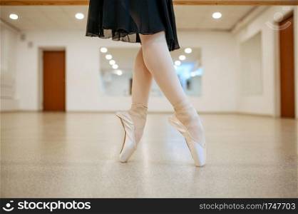 Teen ballerina legs, dance performing in class. Ballet school, female dancers on choreography lesson, girl practicing stretching exercise. Teen ballerina legs, dance performing in class