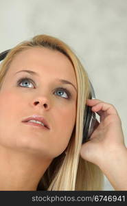 Teen blonde with audio headphones