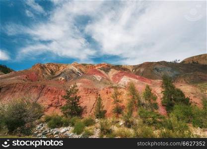 Teen boy in valley of Mars landscapes in the Altai Mountains, Kyzyl Chin, Siberia, Russia. Valley of Mars landscapes