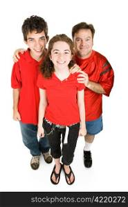 Teen couple and the girls father dressed in red, supporting their favorite sports team. Full body isolated on white.