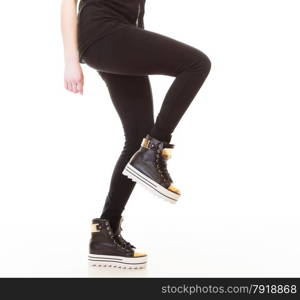Teen fashion. Female legs teenage girl in stylish sneakers