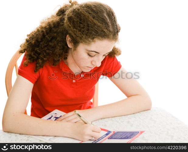 Teen girl filling out a mail-in voters registration form in time to vote in the presidential election. Isolated on white.