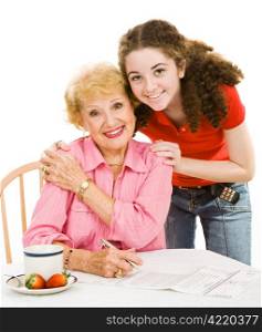 Teen girl helping her grandmother fill out an absentee ballot. Isolated on white.