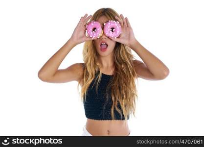 Teen girl holding donuts on her eyes as goggles at white background