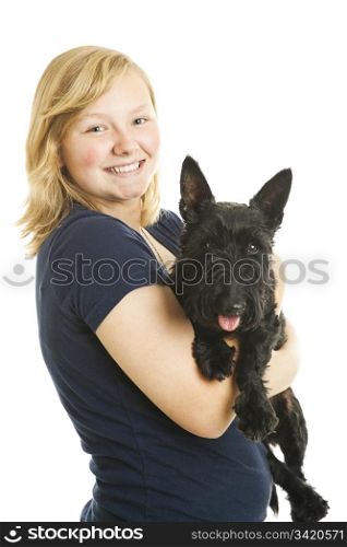Teen girl holding her adorable Scotty dog. Isolated on white.