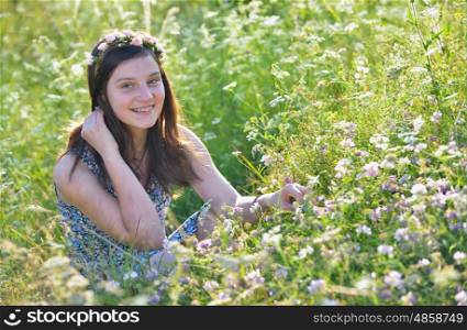 Teen girl in a summer field