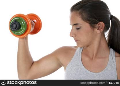 Teen girl lifting hand weights.