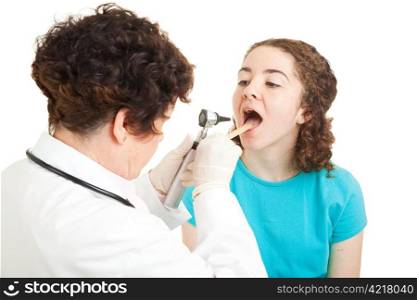 Teen girl opening her mouth so the doctor can check her throat. Isolated on white.