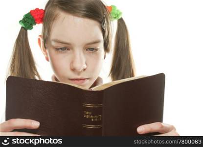 Teen girl reading the Bible isolated on white
