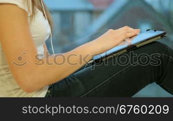 Teen Girl Using Digital Tablet At Home