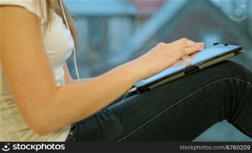 Teen Girl Using Digital Tablet At Home