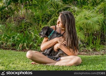 Teen Girl with Labrador Puppy