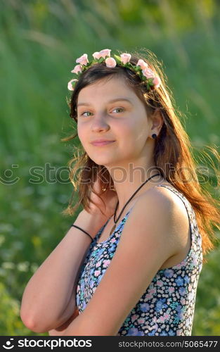 teen girl with wreath in summer time