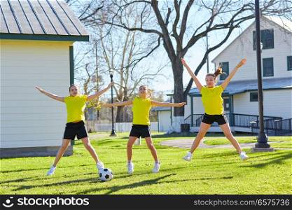 Teen girls group exercise workout jumnping at park