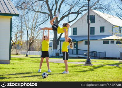 Teen girls group exercise workout jump at park