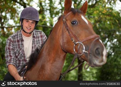 Teen riding a horse