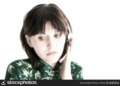 Teen with concerned expression wearing headset.