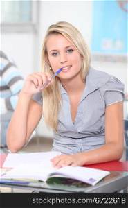 Teen with pen in mouth