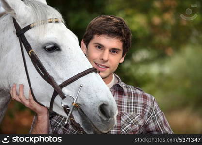 Teen with white horse