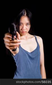 Teenage Asian American girl pointing handgun