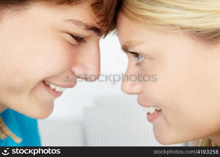 Teenage boy and girl close up profile