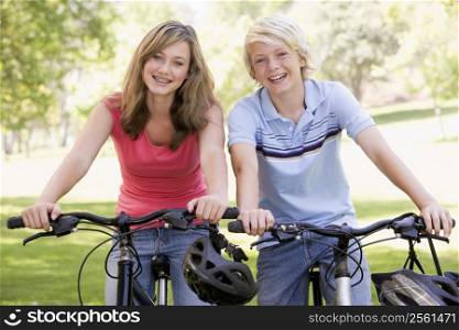 Teenage Boy And Girl On Bicycles