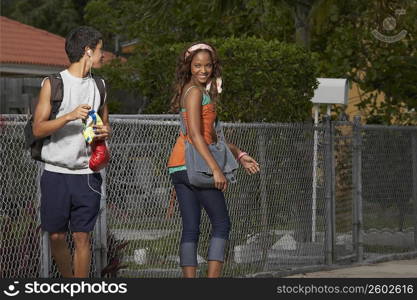 Teenage boy flirting with a young woman