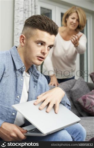 Teenage Boy Hiding Internet Use From Mother