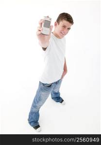 Teenage boy holding up cellular phone and smiling