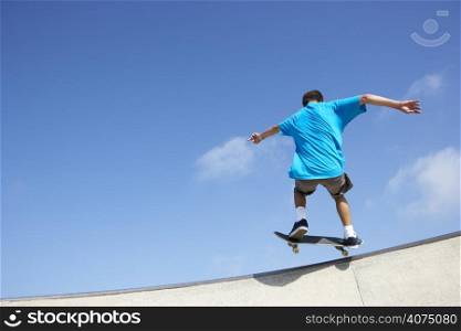 Teenage Boy In Skateboard Park