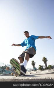 Teenage Boy In Skateboard Park