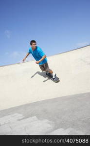 Teenage Boy In Skateboard Park