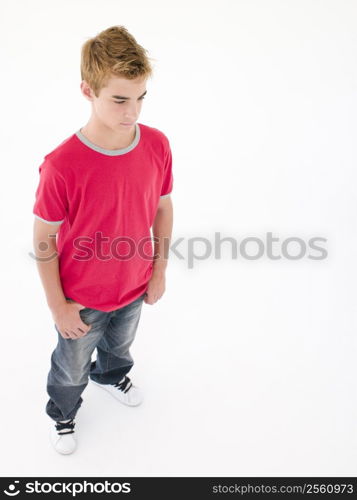 Teenage boy looking down