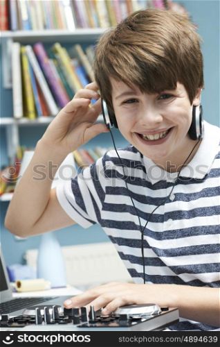 Teenage Boy Mixing Music In Bedroom