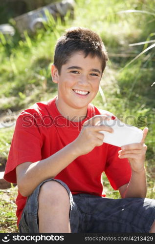 Teenage boy playing with computer game