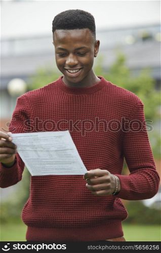 Teenage Boy Pleased With Good Exam Results