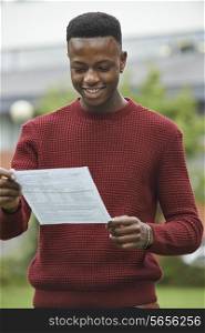 Teenage Boy Pleased With Good Exam Results