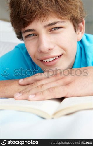 Teenage boy reading a book