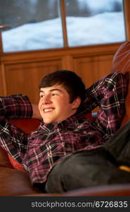 Teenage Boy Relaxing On Sofa