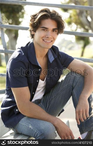 Teenage Boy Sitting On Steps