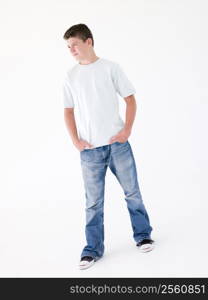 Teenage boy standing with hands in pockets