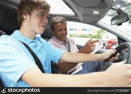 Teenage Boy Taking A Driving Lesson