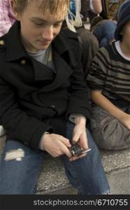 Teenage boy using a mobile phone