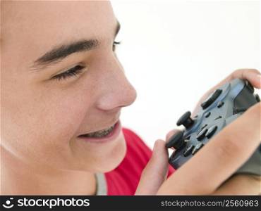 Teenage boy using videogame controller