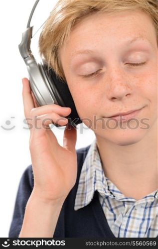 Teenage boy with eyes closed enjoying music over white background