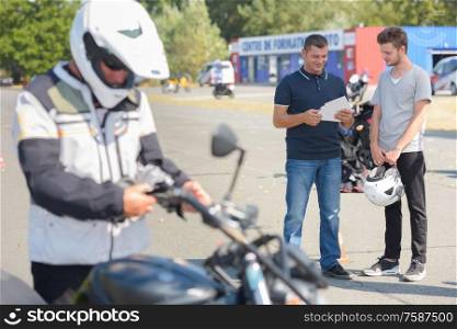 teenage boy with motorbike and driving license
