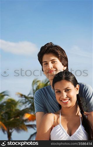 Teenage couple (16-17) on beach portrait