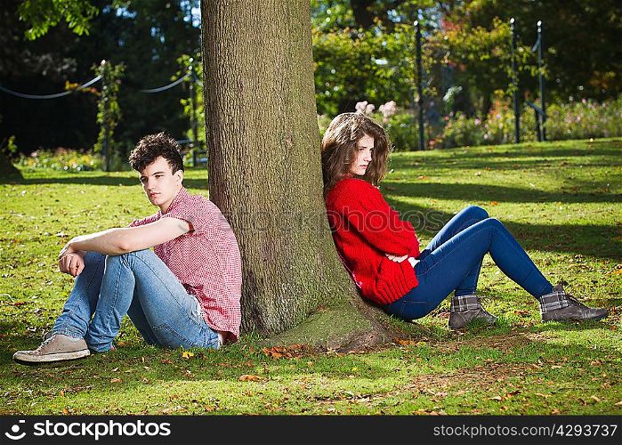 Teenage couple arguing in park
