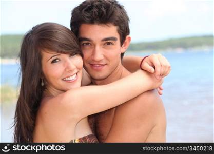 Teenage couple by the beach.